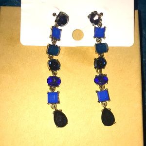 Dangling blue gem earrings.